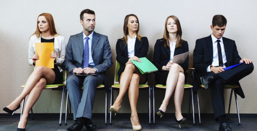 image of professionals sitting in a row in a waiting room