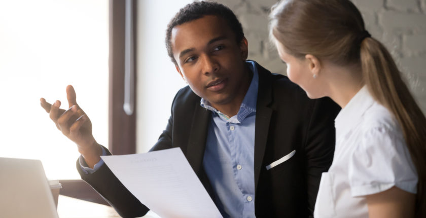 African american boss negotiating discussing contract details with company corporate woman client. Black hr manager interviewing young female job candidate. Employment hiring human resources concept