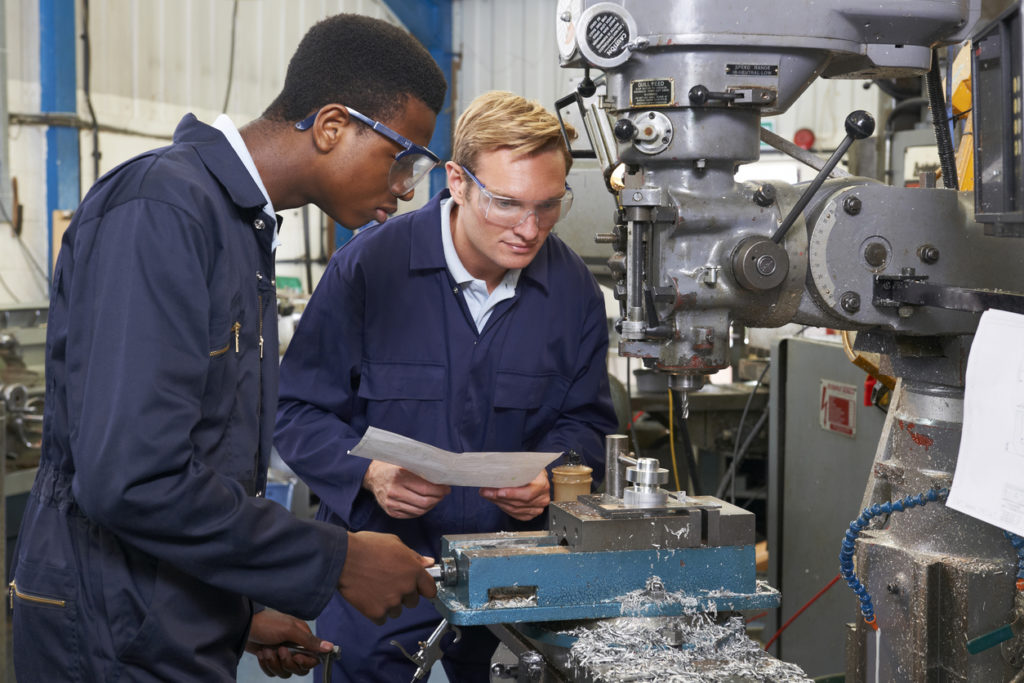 men working on a machine