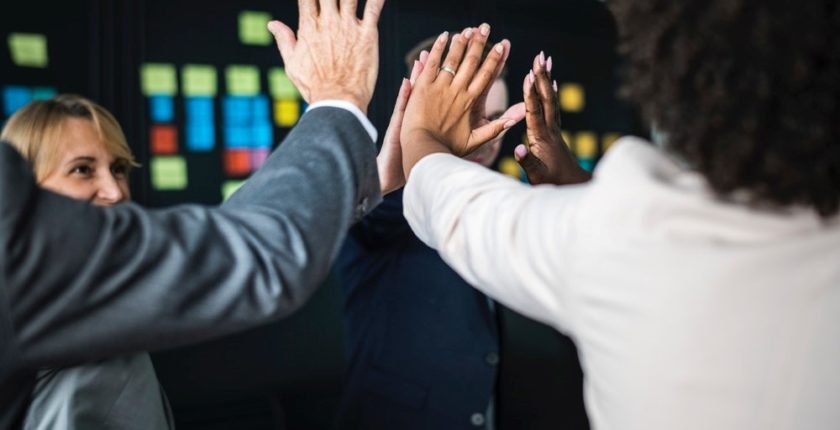 colleagues giving each other high fives