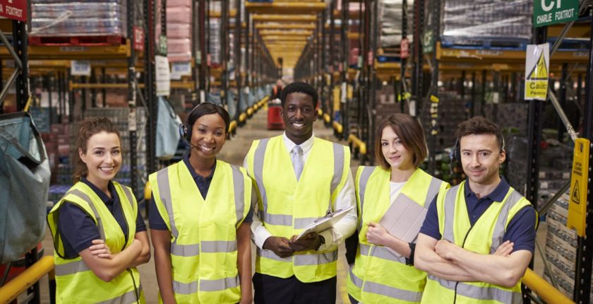 warehouse team mates in reflective vests