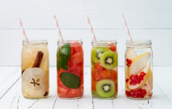 glass jars filled with fruit and water