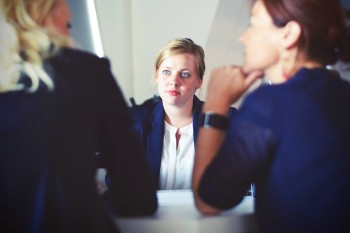 woman being interviewed by 2 other women