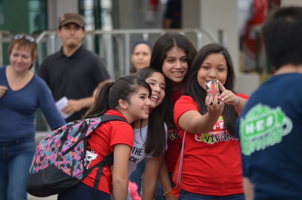 pre-teen students posing for a selfie