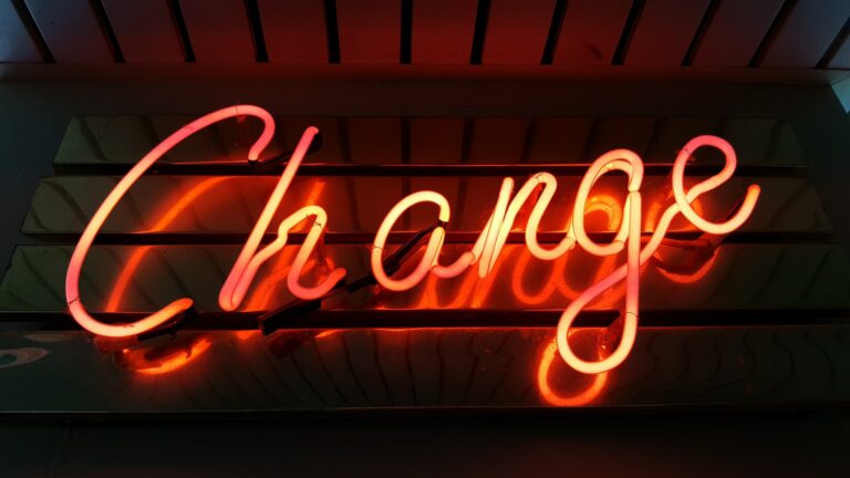 neon sign that says "change"