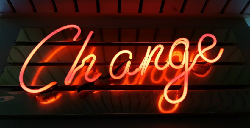 neon sign that says "change"