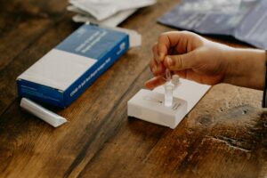 Person prepares a rapid testing kit