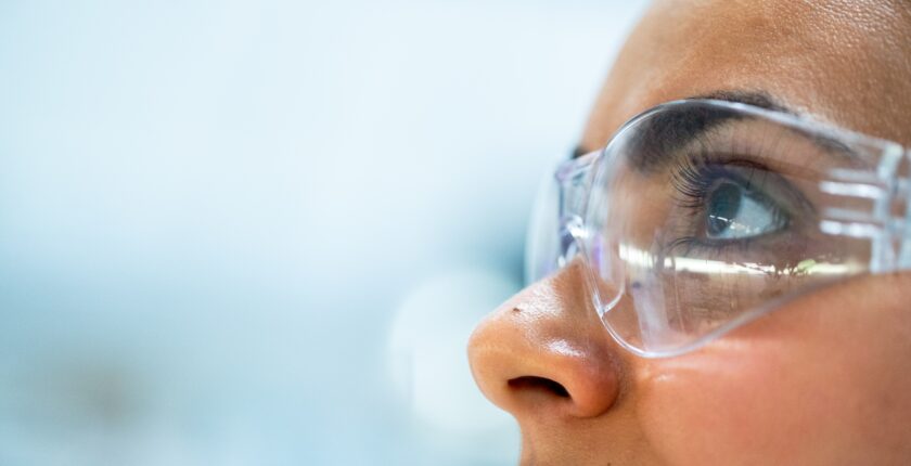 side profile of woman wearing safety goggles