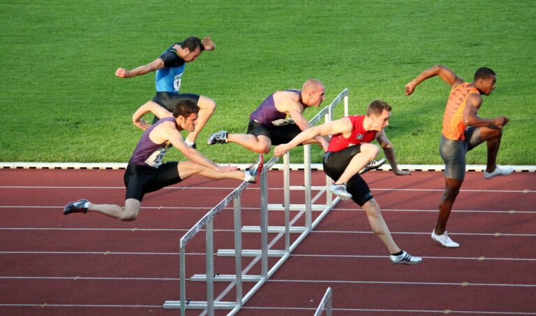 athletes jumping over hurdles - slow interview