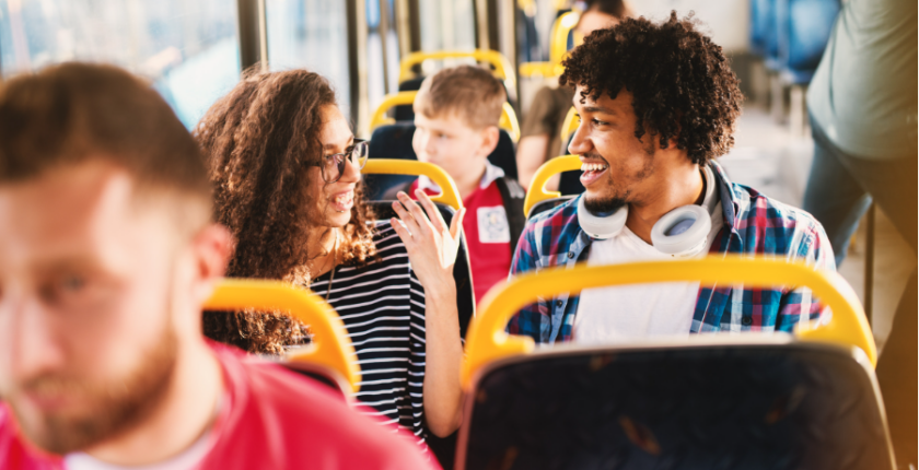 Passengers chat on a bus