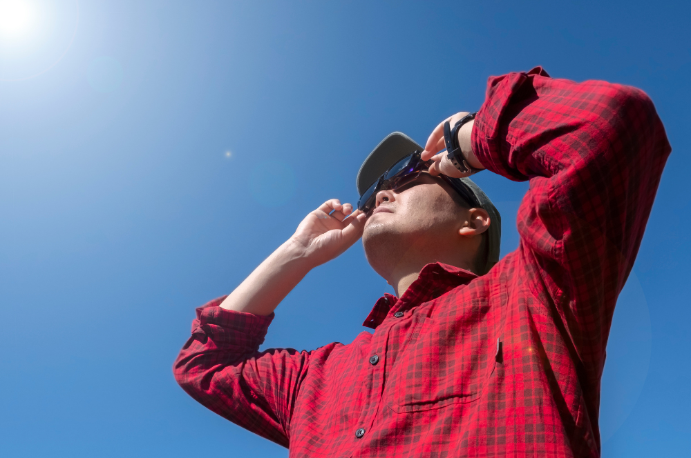 Man wearing eclipse glasses