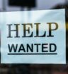 Help wanted sign in a window.